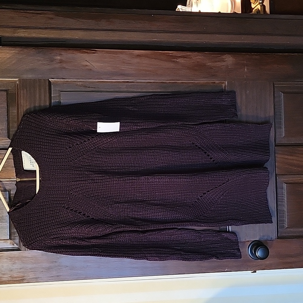 Grape coloured sweater dress. Back zip. Knitted detailing. Never worn.